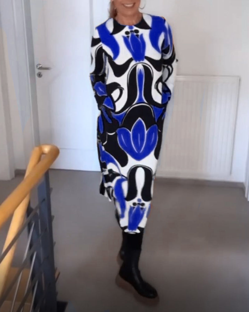 KlÀnning med tryck och rund halsringning