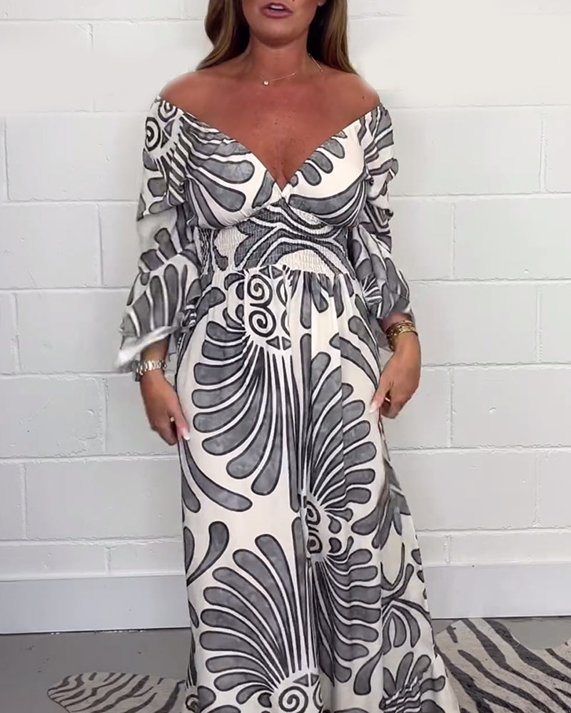 Lös jumpsuit med djup V retrotryckt klockärm