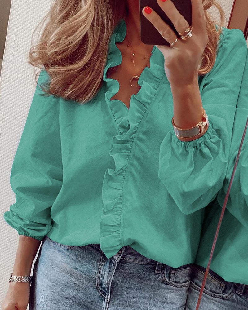 EnfÀrgad blus med puffÀrmar