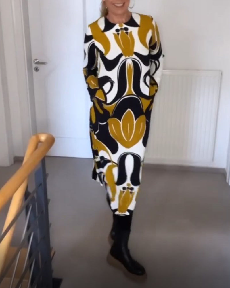 KlÀnning med tryck och rund halsringning