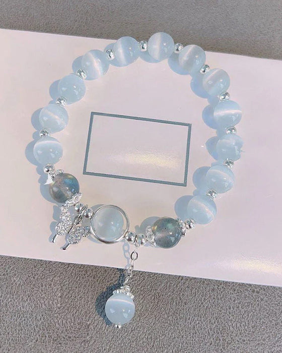 Imiterande kattögonkristallfjärilssmycke