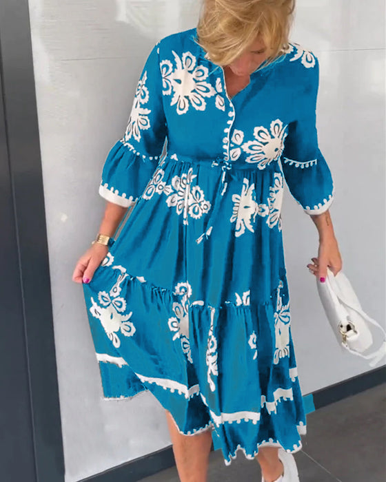 Blommig klänning med 3/4 ärm