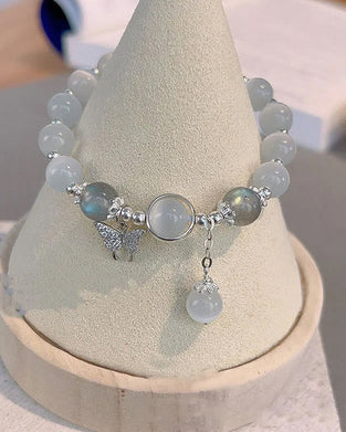 Imiterande kattögonkristallfjärilssmycke