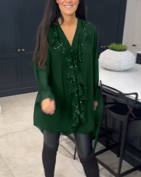 Blus med volanger och elegant stil