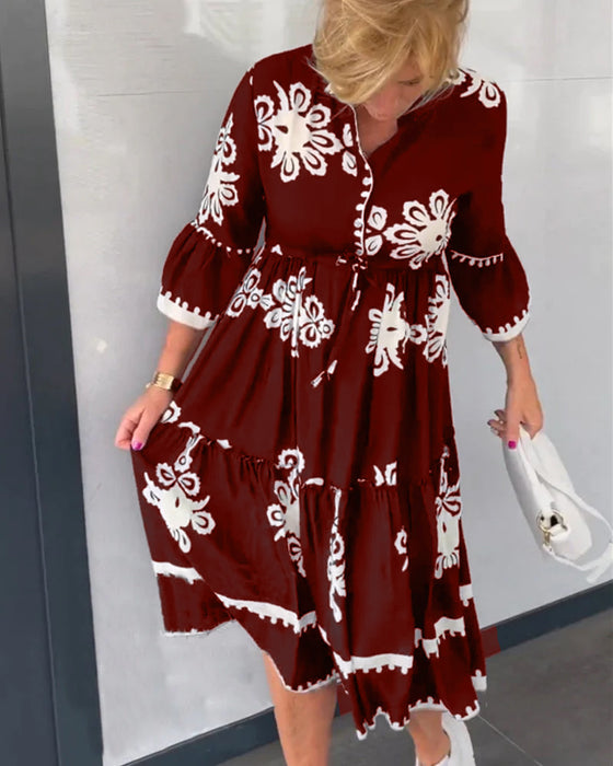 Blommig klänning med 3/4 ärm