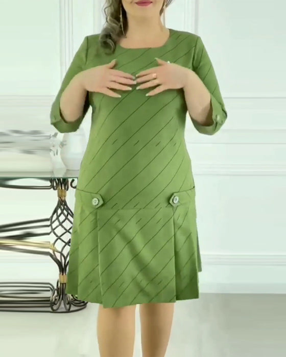 Elegant klänning med rund hals och tryck