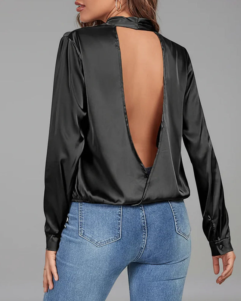 Elegant enfärgad skjorta med lång ärm och rygglös