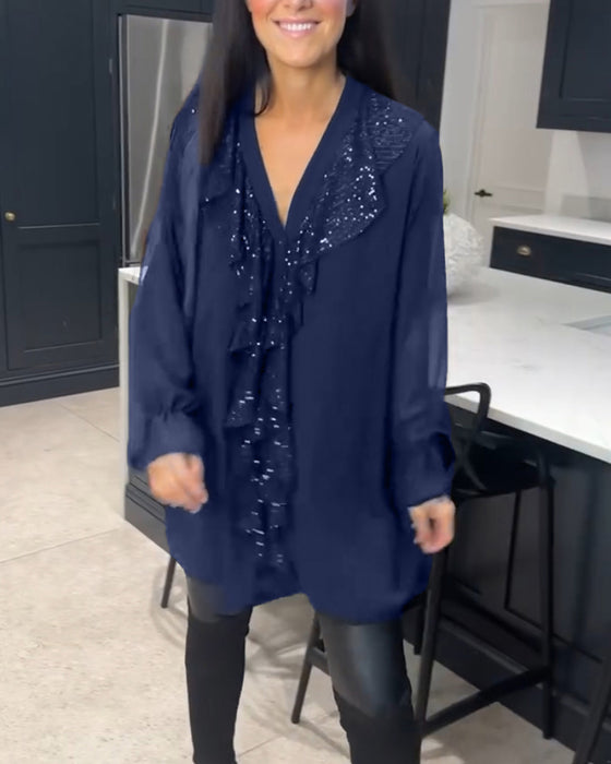 Blus med volanger och elegant stil