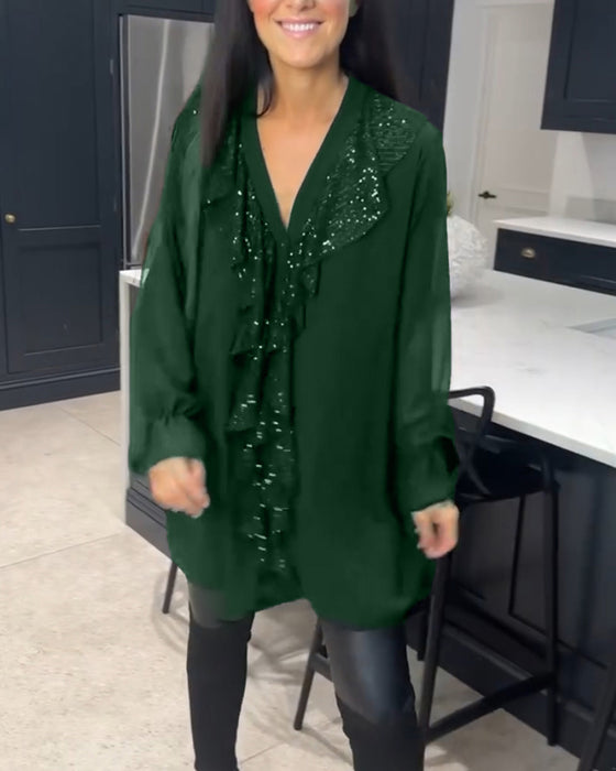 Blus med volanger och elegant stil