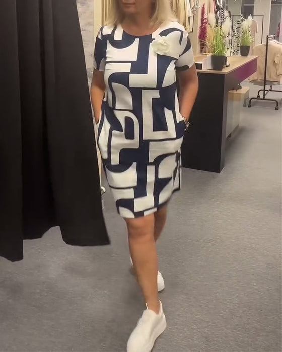 Geometriskt tryck fickklänning med rund hals