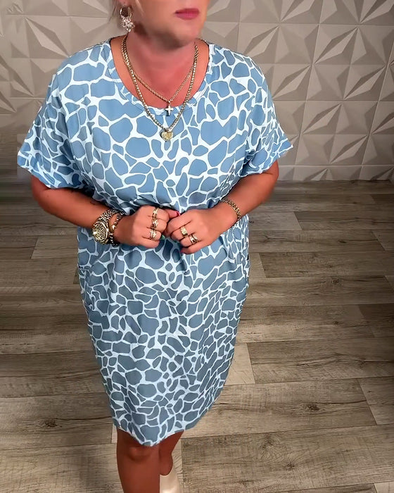 Klänning avslappnad med tryck och rund halsringning