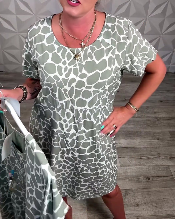 Klänning avslappnad med tryck och rund halsringning