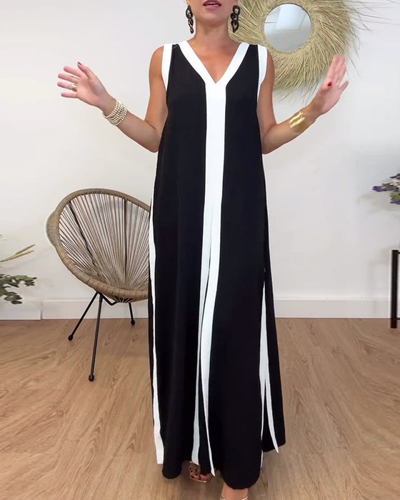 Trendig ärmlös klänning med V-ringad kontrasttryck