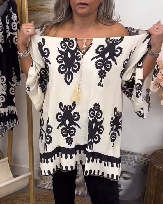 Blus med off-the-shoulder och löst sittande