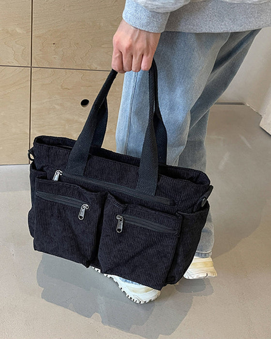 Enfärgad manchesterväska