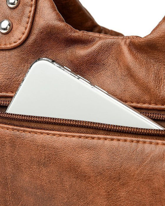 Vintage mjuk läderhandväska och budbärarväska.