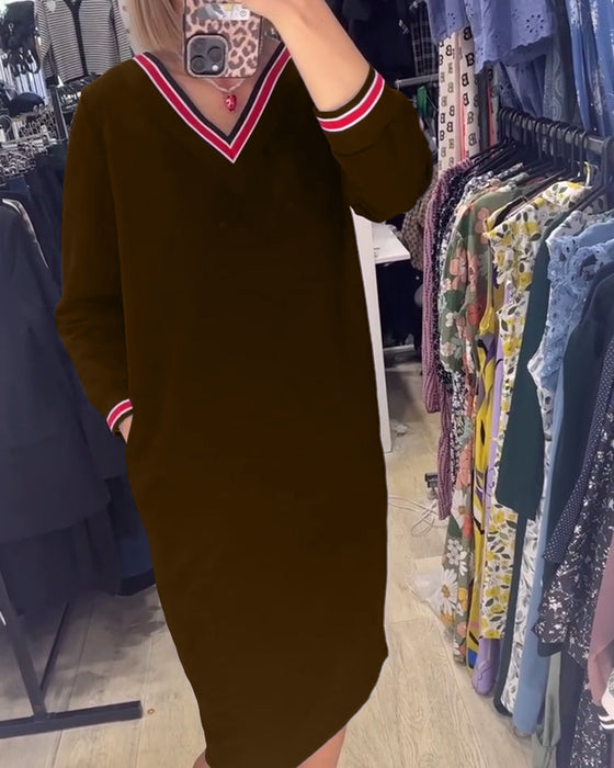 V-ringad klänning med fickor