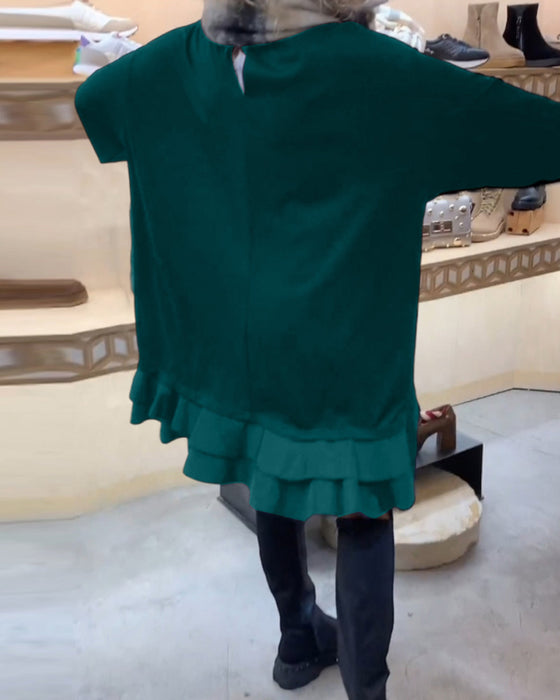 Klänning med elegant siluett och långa ärmar