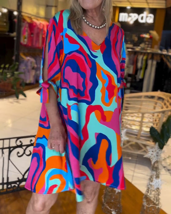 Rundhalsad klänning med tryck