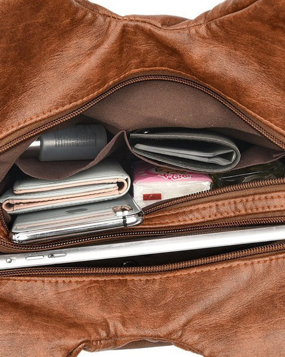 Vintage mjuk läderhandväska och budbärarväska.