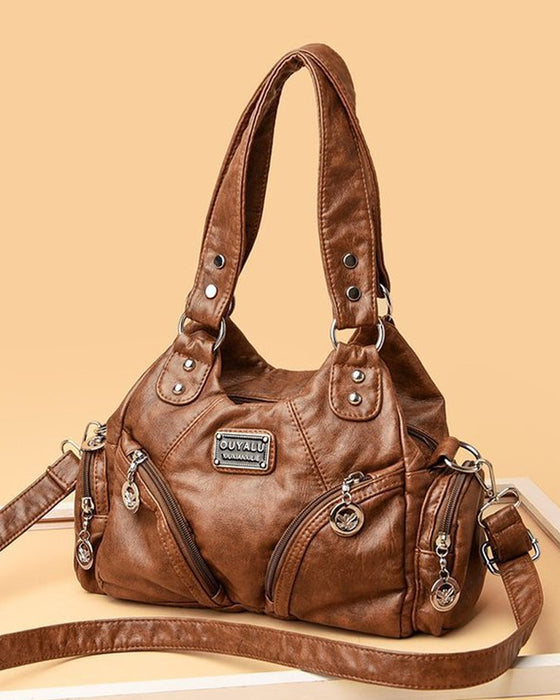 Vintage mjuk läderhandväska och budbärarväska.