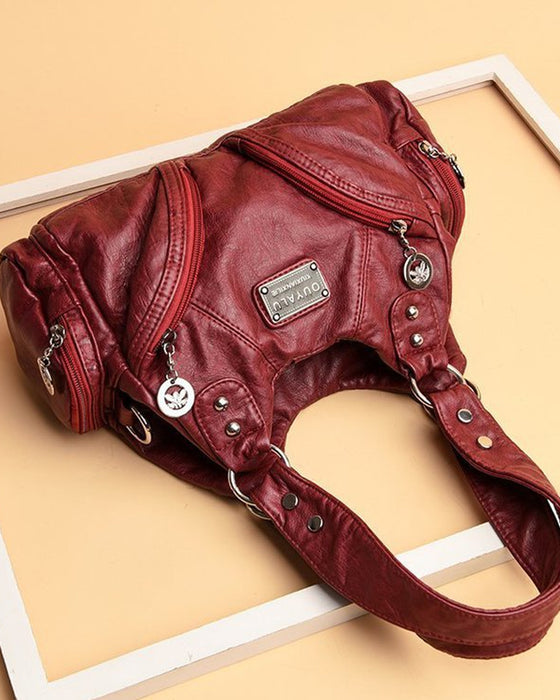 Vintage mjuk läderhandväska och budbärarväska.