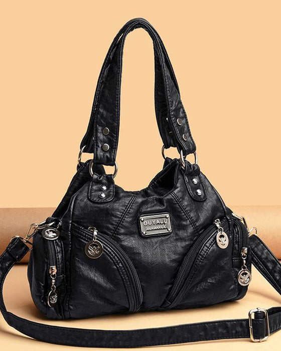 Vintage mjuk läderhandväska och budbärarväska.