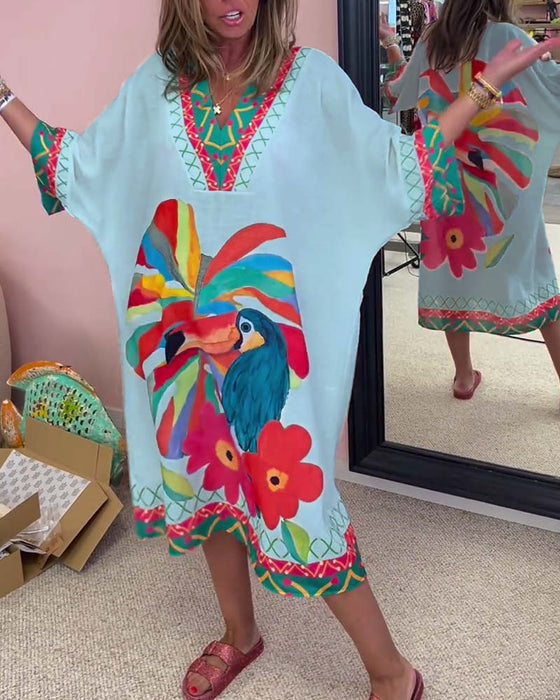 V-ringad klänning med graffititryck