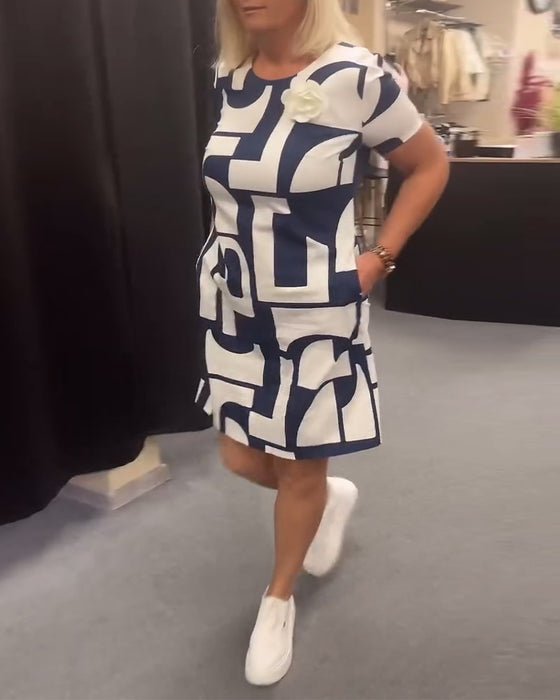 Geometriskt tryck fickklänning med rund hals