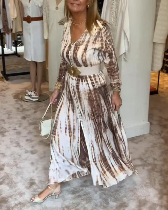 Tryckt långärmad klänning med V-ringad slits i midjan