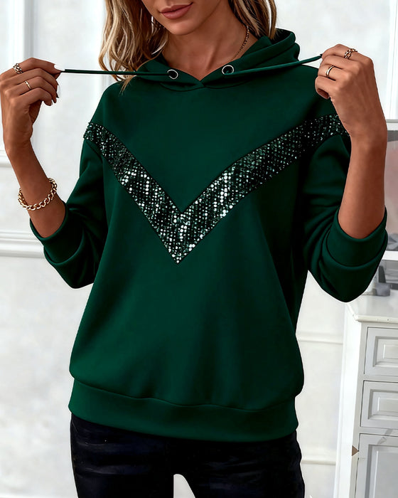 Långärmad huvtröja i patchwork av enfärgade tyger