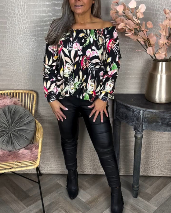 Blus med tryck och en axel