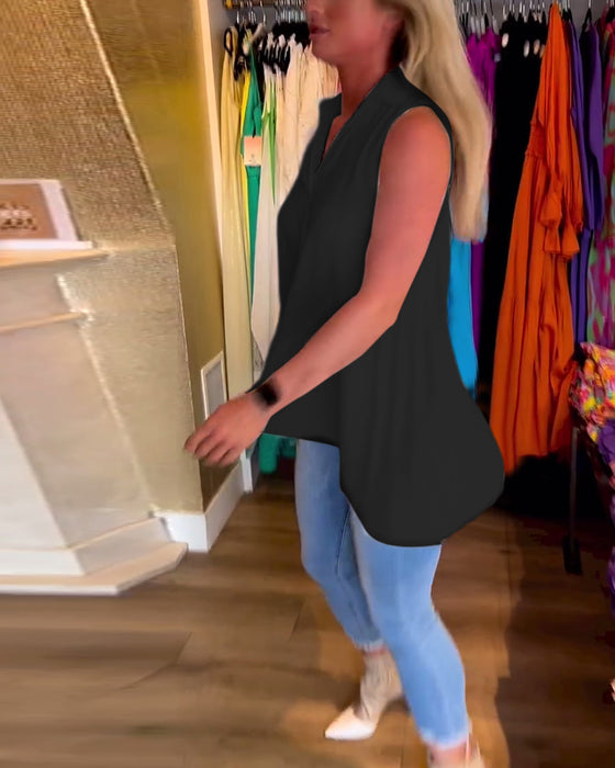 Ärmlös topp med volanger och slag