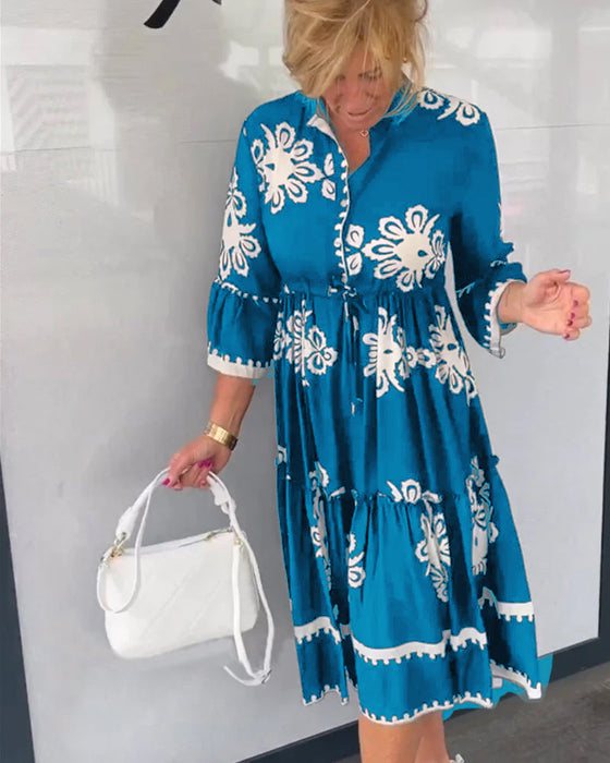 Blommig klänning med 3/4 ärm