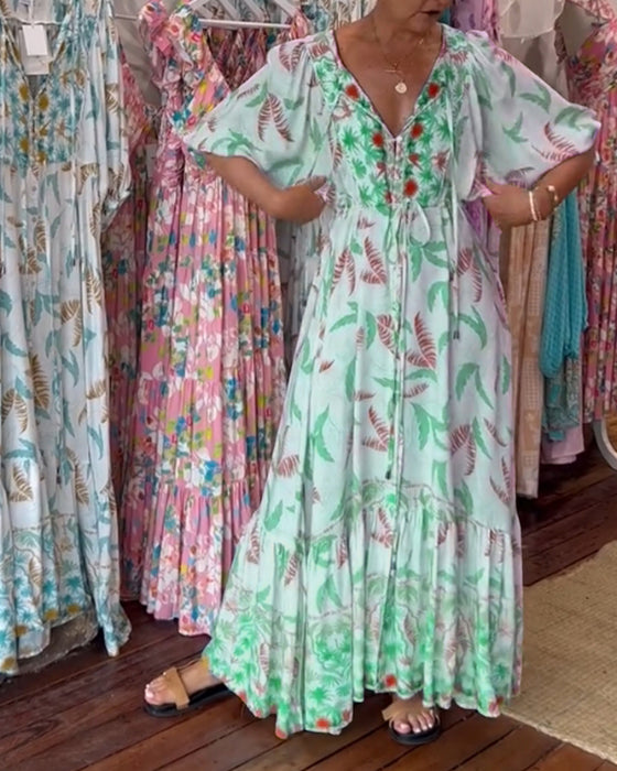 V-ringad maxiklänning med bladtryck för kvinnor