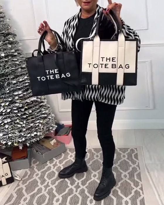 Modeväska med tvåfärgssömmar