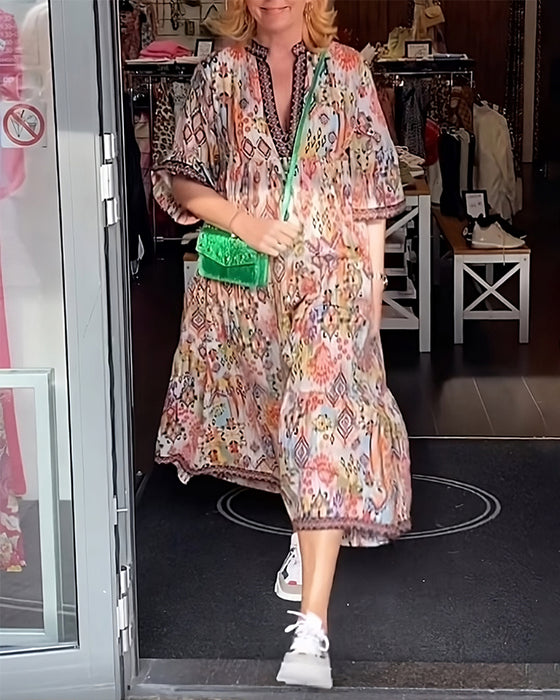 V-ringad elegant lång klänning med tryck