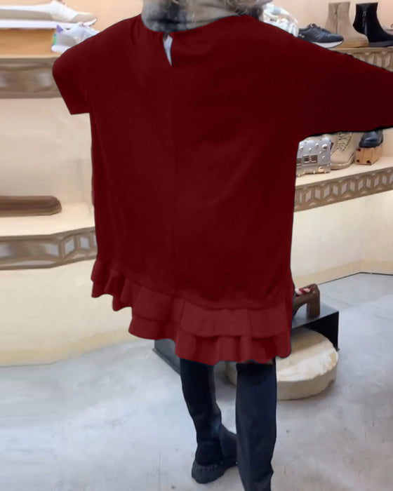 Klänning med elegant siluett och långa ärmar