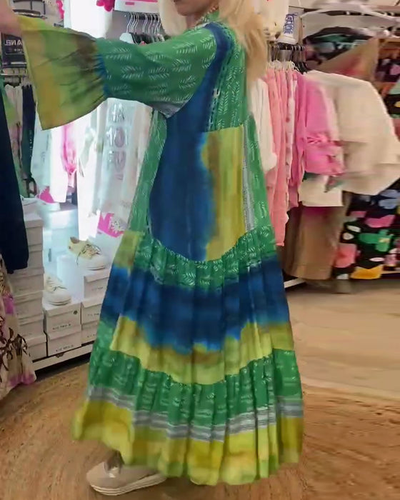 Tryckt avslappnad V-ringad lång klänning med utsvängda ärmar