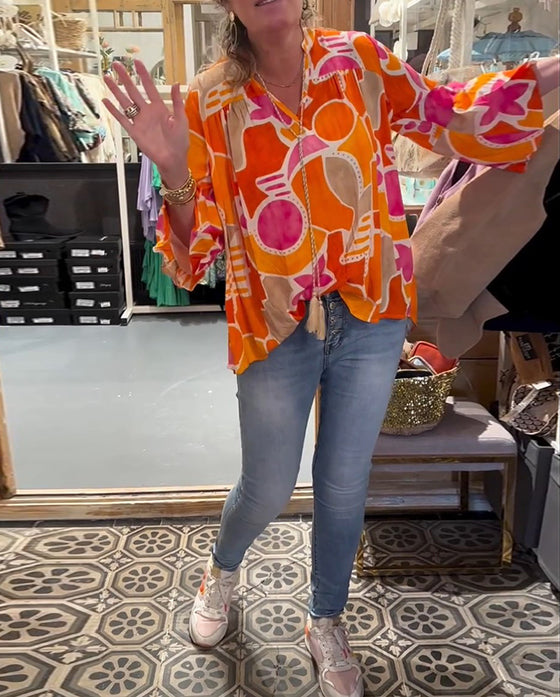 Blus med färgstarkt och långärmad design