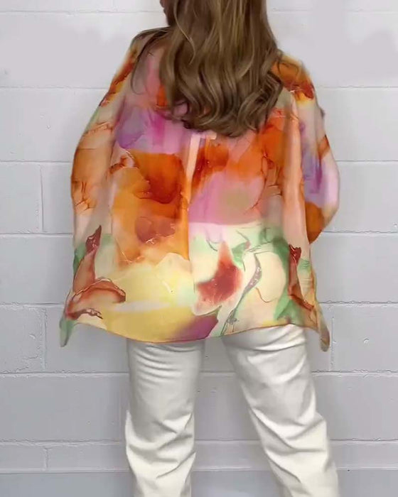 Avslappnad blus med V-ringning och lång ärm