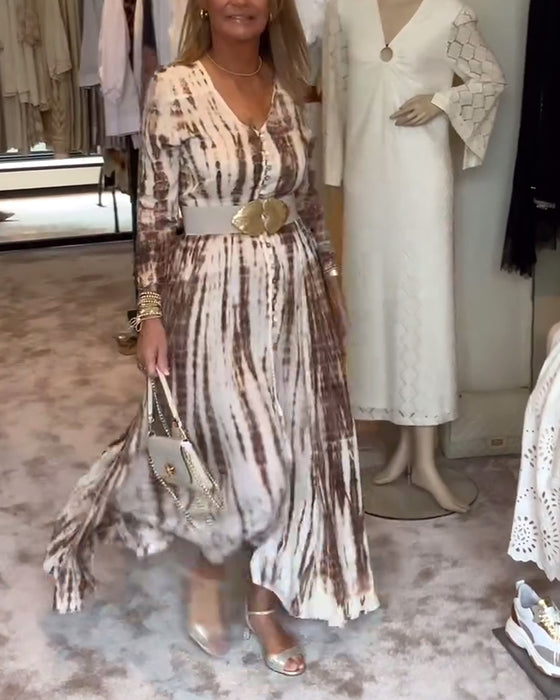 Tryckt långärmad klänning med V-ringad slits i midjan