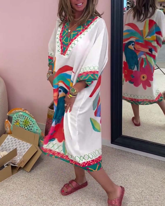 V-ringad klänning med graffititryck