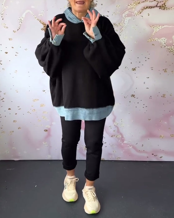 Avslappnad luvtröja på lyktaärm i kontrastfärg