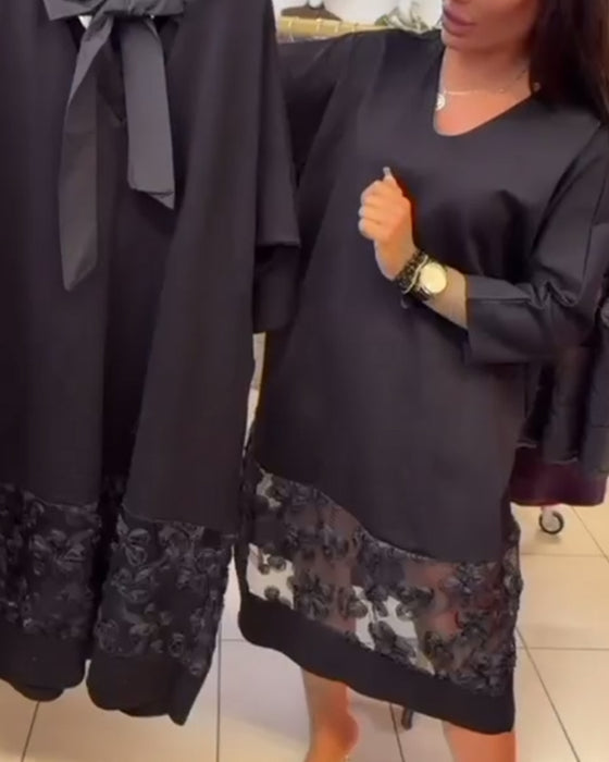 Stilfull Klänning Med Rosett På Ryggen Och V-Ringning