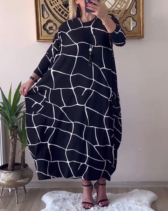 Klänning med rund hals långärmad ficka lös