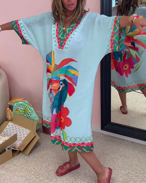 V-ringad klänning med graffititryck