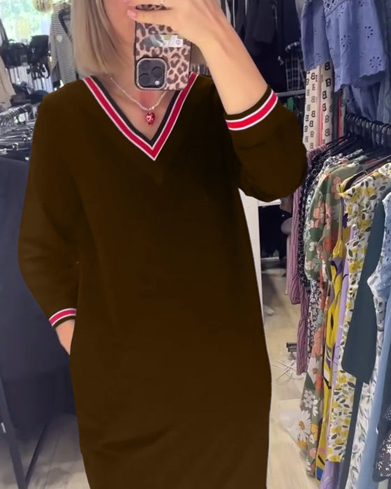 V-ringad klänning med fickor