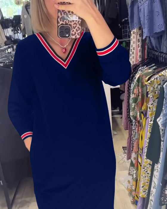 V-ringad klänning med fickor