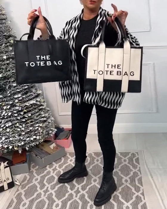 Modeväska med tvåfärgssömmar